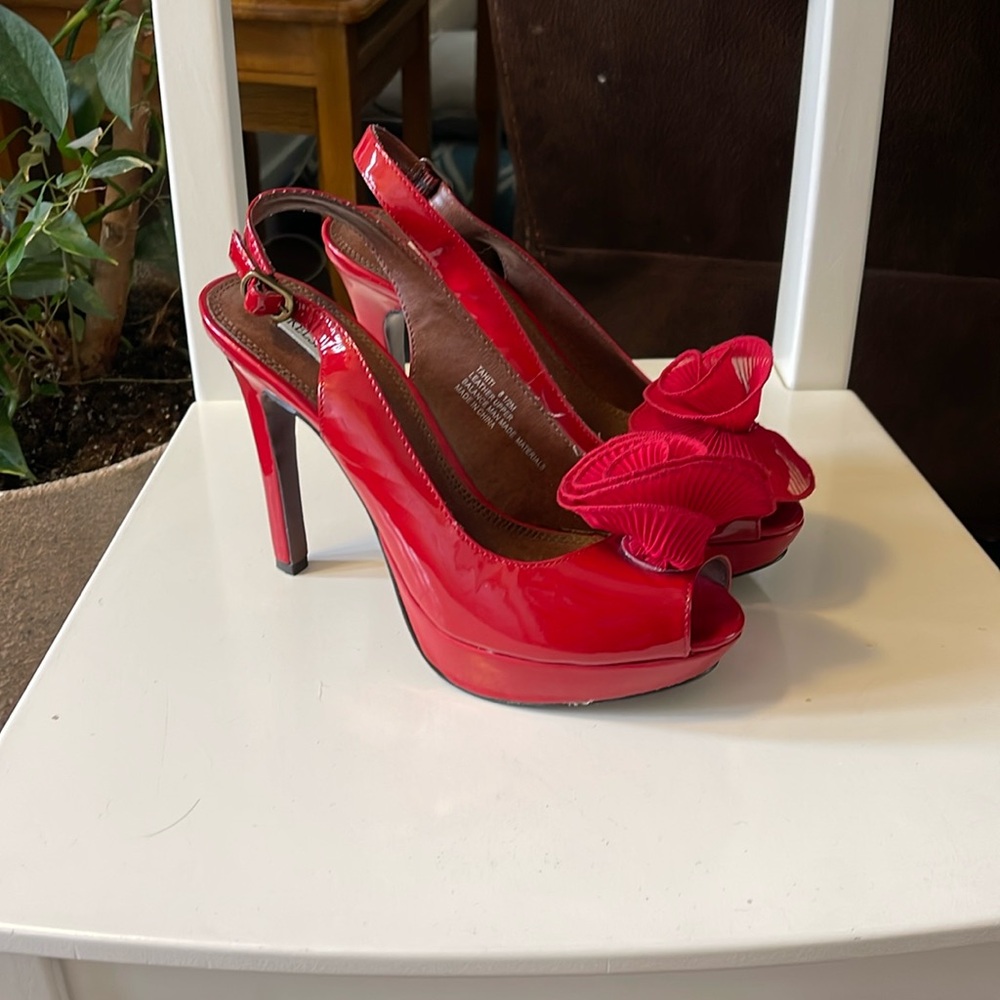 Kelsi Dagger 5” wedge red high heels with a flower detail